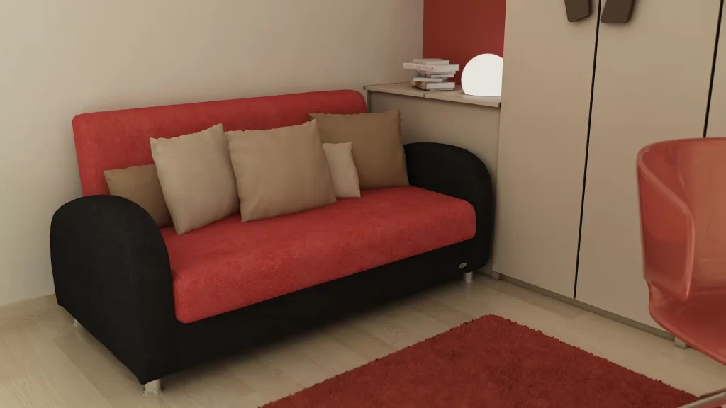 یک مبل تختخوابشو که در یک اتاق قرار دارد و در حالت بسته بوده و با کوسن تزئین شده است